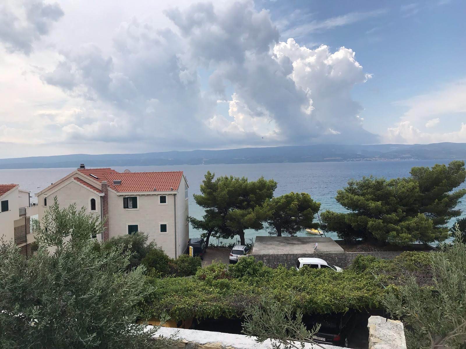 View of the sea and neighbouring houses from the villa terrace