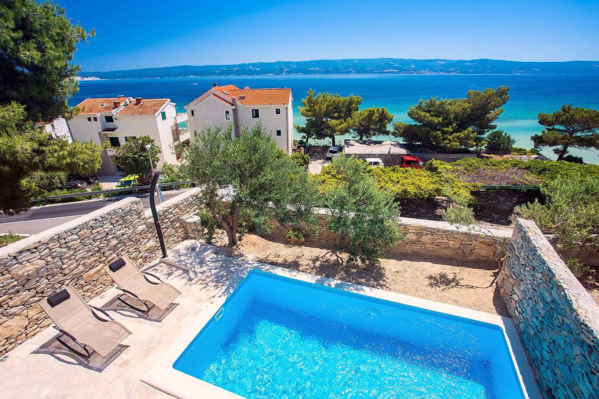 Aerial view of Villa Kantarion's pool overlooking the Adriatic Sea